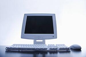 Still life of computer monitor, keyboard and mouse