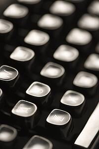 Close up of type levers on typewriter keyboard
