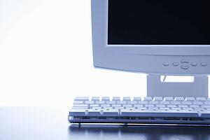 Still life of computer monitor and keyboard. 
