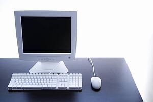 Still life of computer monitor, keyboard and mouse