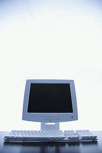 Still life of computer monitor and keyboard.