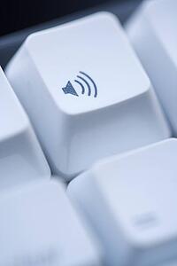 Close up of volume key on computer keyboard