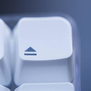 Close up of eject key on computer keyboard.