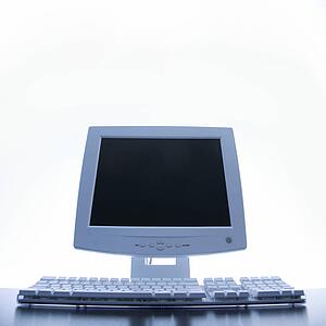 Still life of computer monitor and keyboard.