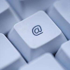 Close up of at sign key on computer keyboard