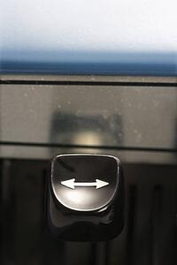 Close up of arrow type lever on typewriter.