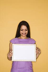 Woman holding blank sign