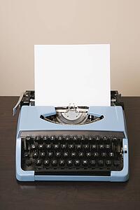Blank sheet of paper in an old fashioned typewriter