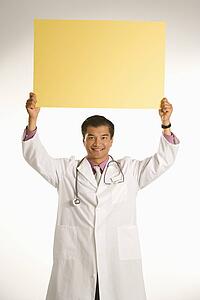 Doctor holding blank sign