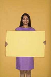 Woman holding blank sign
