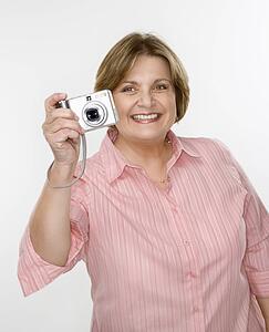 Woman taking photo with digital camera