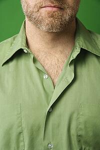 lower half of man's face with beard and shirt with collar open