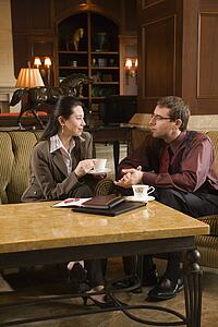 businessman and woman drinking coffee 