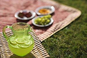 pitcher of lemonade and picnic spread 