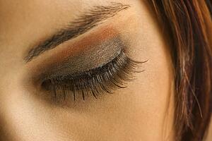 Close up of young adult woman's eye with makeup.