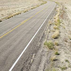 Road through barren landscape in Utah
