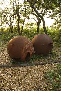 Two rusty metal balls.