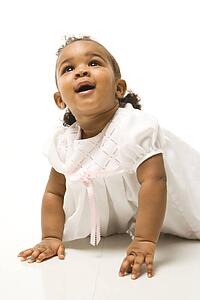 Portrait of infant girl against white background