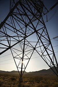 Electrical power lines in desert landscape