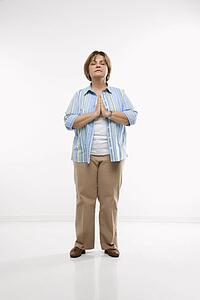 Woman standing while praying
