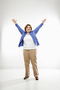 Woman standing with arms in the air 