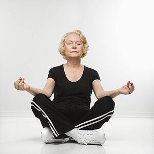 Woman sitting in yoga position