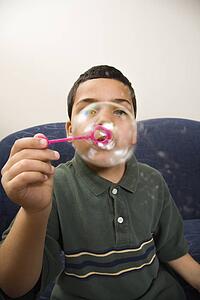 Blowing large soap bubble