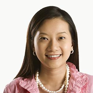 Portrait of young adult woman smiling and looking at viewer