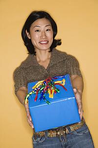 Woman holding out present