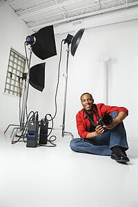 Male sitting on studio floor 