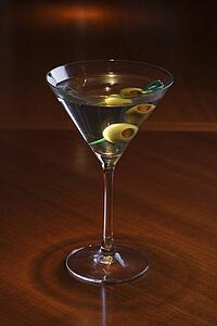Still life of martini on bar.