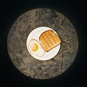 Toast and fried egg on plate