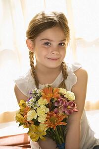 Smiling with bouquet of flowers