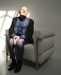 Senior adult male sitting in chair