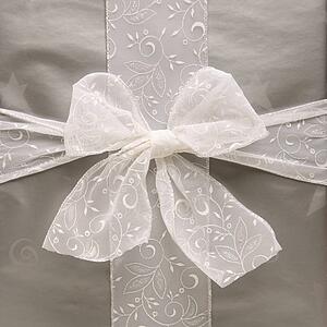 large silver wrapped gift with bow
