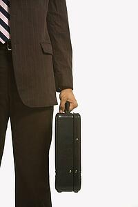 Businessman in suit holding briefcase