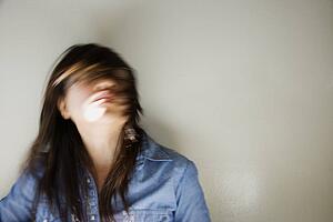 Woman swinging head and hair around