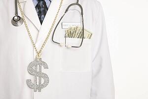 Caucasian mid adult male physician with dollar sign necklace and cash hanging out of pocket.