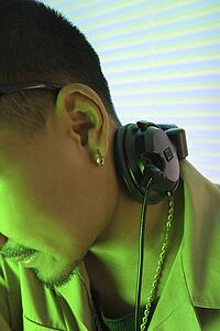 DJ's ear and profile with headphones