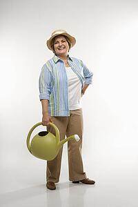 Woman holding watering can