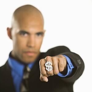 African American man wearing ring with money sign.