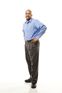 Portrait of man standing against white background