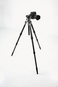 Studio shot of camera and tripod