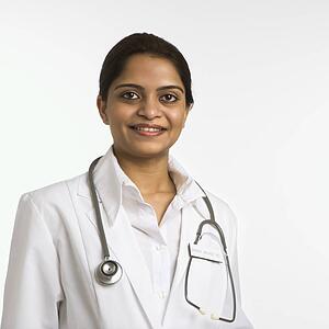 Indian woman doctor head and shoulder portrait on white background.