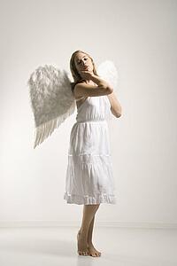 Woman in white angel costume