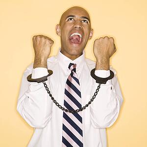 Man wearing handcuffs and screaming