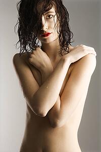 Redhead woman with wet hair and skin