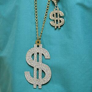 Close-up of green medical scrubs with two dollar sign necklaces.