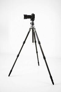 Studio shot of camera and tripod