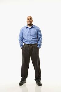 Portrait of man standing against white background